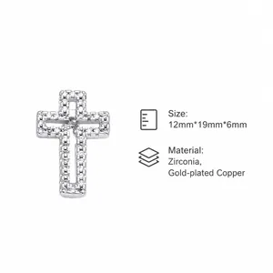 Macro detail of silver cross pendant with white zircon pavé and product dimensions