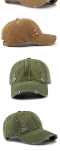 Detailed view of washed denim baseball cap with distressed frayed edges and vintage texture