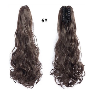 Detail showing the inner claw clip structure and long wavy dark brown ponytail hair