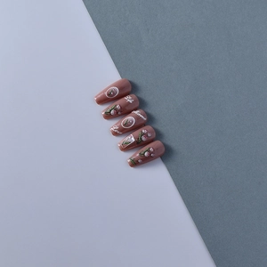 Detailed view of 5D embossed nail stickers featuring tulips and pearls in vintage style