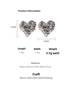 Detail view of silver heart earrings with lava texture, zircon inlay, and size dimensions