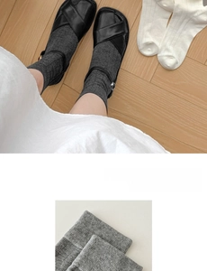 Close-up of thin grey slouch socks showing fine knit texture and breathable fabric detail