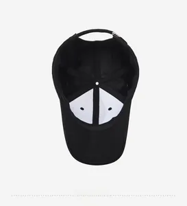 Interior detail of a black baseball cap showing reinforced lining and stitching seams
