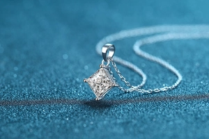 Macro shot of 925 sterling silver princess cut moissanite pendant with four-prong setting
