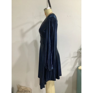 Detail of navy blue satin mini dress with ruched balloon sleeves on a mannequin
