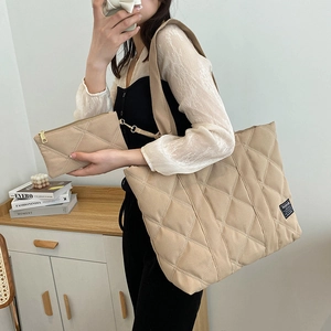 Beige puffer tote bag with quilted diamond pattern and matching small pouch