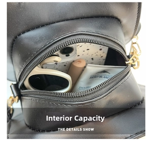 Detail view of the cat-shaped PU bag interior showing capacity for sunglasses and lipstick