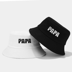 Black and white cotton bucket hats with PAPA embroidery and fishing theme icons