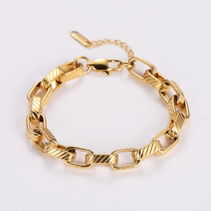 Detailed view of gold stainless steel chain link bracelet with lobster clasp and extender