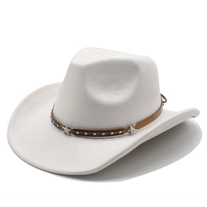 Detail of white felt cowboy hat with a studded brown band and silver star accents