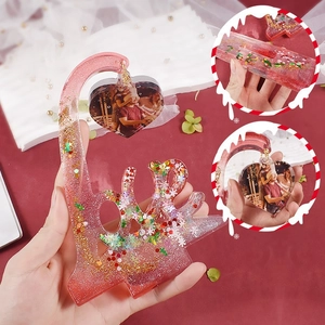 Macro shot of LOVE resin mold base with heart-shaped photo frame and gold sequins