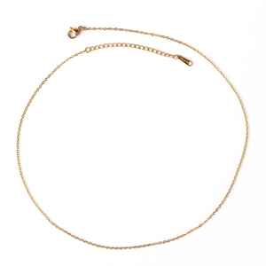 Detailed macro view of a gold-plated stainless steel chain necklace with lobster clasp