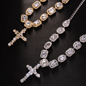 Cross pendant necklace with rectangular and oval zircons in gold and silver finish