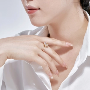 Detail of s925 silver gold-plated ring with ice-flower cut zircon on model's hand