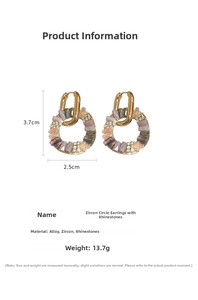 Detail view of gold earrings with multicolored zircon crystals, size 3.7cm x 2.5cm