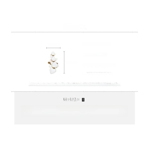 Detailed specs of white petal clip-on earrings in copper with gold plated accents