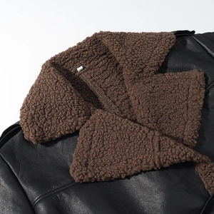 Women's black faux leather jacket featuring a brown faux shearling collar and lapel