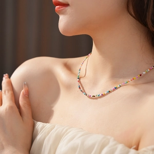 Close-up of a colorful beaded glass necklace on a woman for a summer vacation look