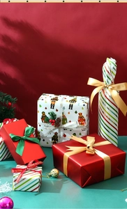 Christmas gift wrapping paper with nutcracker patterns and festive ribbons for holiday DIY