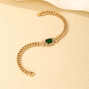 Gold plated stainless steel Cuban chain bracelet with rectangular emerald green zircon gem