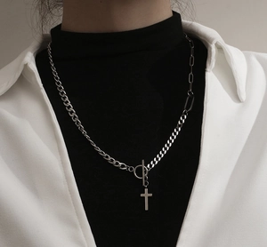 Detail of silver titanium cross necklace featuring a mix of Cuban and paperclip chains