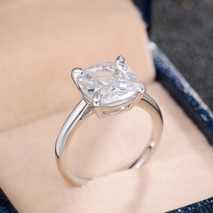 Detailed close-up of a silver square-cut zirconia engagement ring in a premium gift box