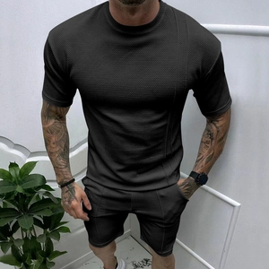 Men's summer tracksuit set featuring black waffle knit short sleeve t-shirt and shorts