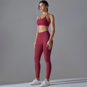 Detail of burgundy seamless yoga set featuring thin straps and high-waisted leggings