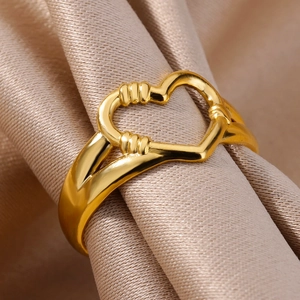 Macro view of a 18k gold plated stainless steel heart ring with intricate vintage carvings