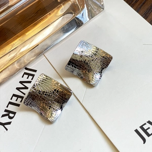 Modern irregular square earrings with brushed silver texture and wave surface design