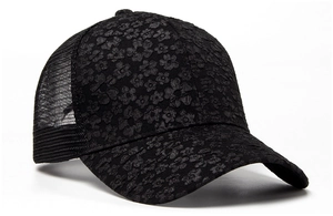 Detailed view of black floral lace embroidery on breathable mesh baseball cap