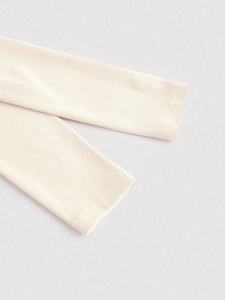 Camiseta de punto acanalado blanco crema de manga larga con ajuste ceñido y tejido suave