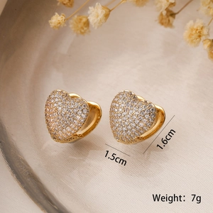 Elegant gold heart earrings with pavé zircon stones on a silk tray, size 1.5x1.6cm