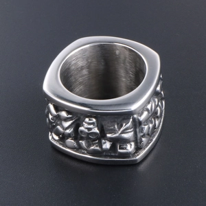 Retro stainless steel wide signet ring for men featuring detailed embossed character design