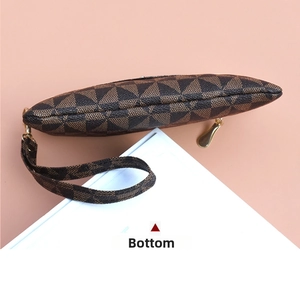 Bottom view of small PU leather clutch bag featuring dark brown geometric triangle prints