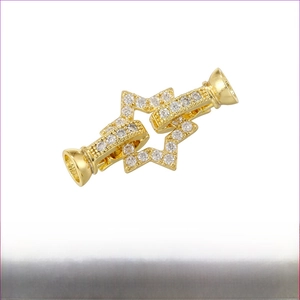 Detail of 18K gold plated brass interlocking star clasp with micro-pave zircons for jewelry
