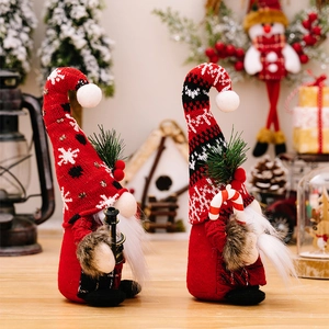 Christmas gnome set with red knit hat, black lantern and candy cane holiday decoration