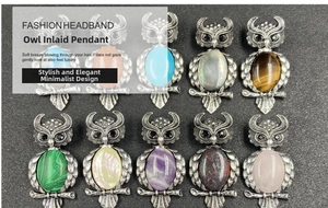 Detailed view of ten bohemian owl pendants set with various colorful oval gemstones