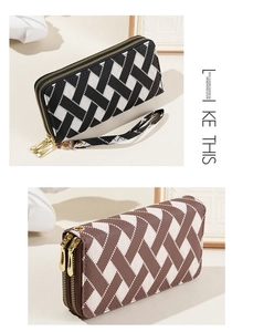 Detail of long double-zipper wallet with woven texture and elegant wrist strap