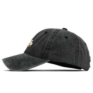 Close-up of side view showing washed cotton fabric and embroidery on baseball cap