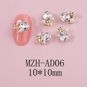 Close-up of 10x10mm floral nail charms with white pearls and square crystals on pink background