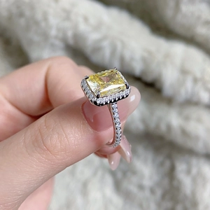 Macro detail of S925 silver ring featuring a radiant cut yellow zircon and pavé diamonds
