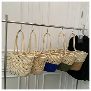Detail shot of woven tote bags featuring various patterns and colorful contrast colors