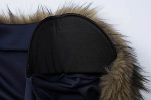 Detail view showing blue fabric texture and brown faux fur collar with black padded lining