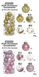 Detail view of 6cm gold and pink Christmas baubles with various textures and finishes
