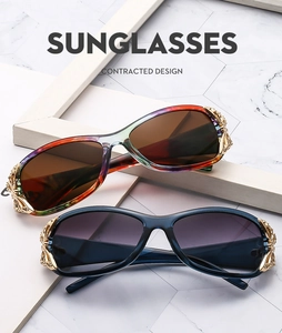 Detail of golden hollow-out floral carving on wrap-around butterfly sunglasses temples