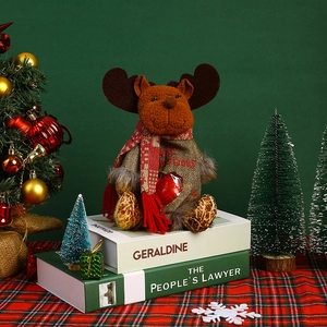 Detail of reindeer Christmas gift bag with a red window and Merry Christmas text