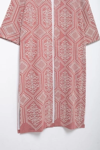 Close-up detail of geometric embroidery on a pink mid-length cardigan coat