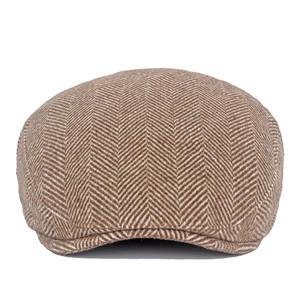 Detail shot of men's brown herringbone wool blend newsboy cap with classic retro texture
