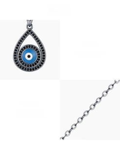 Macro shot of S925 sterling silver evil eye pendant with pavé set black and blue cubic zirconia